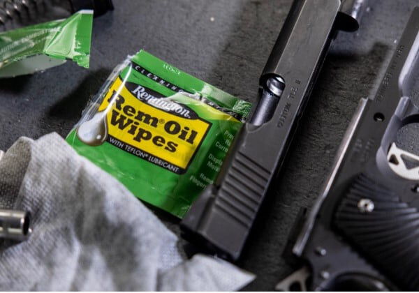 Rem Oil Wipes package next to a pistol