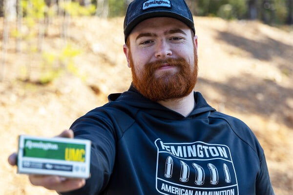 Ben Bell holding up a Remington UMC Ammo Box