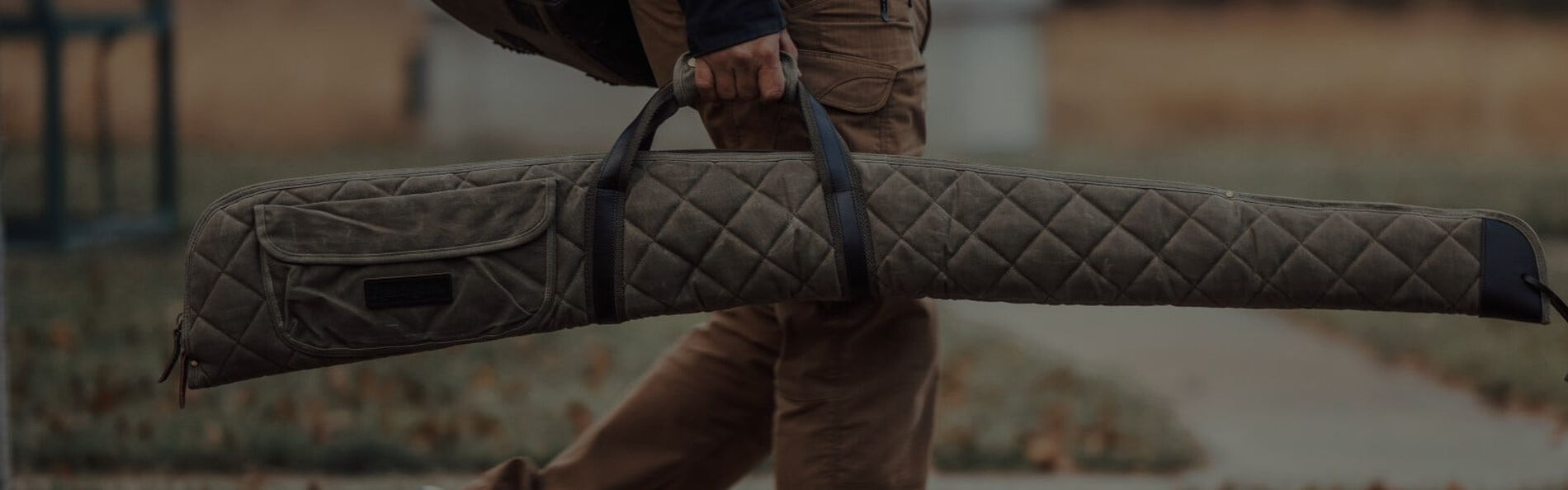 person carrying a rifle case