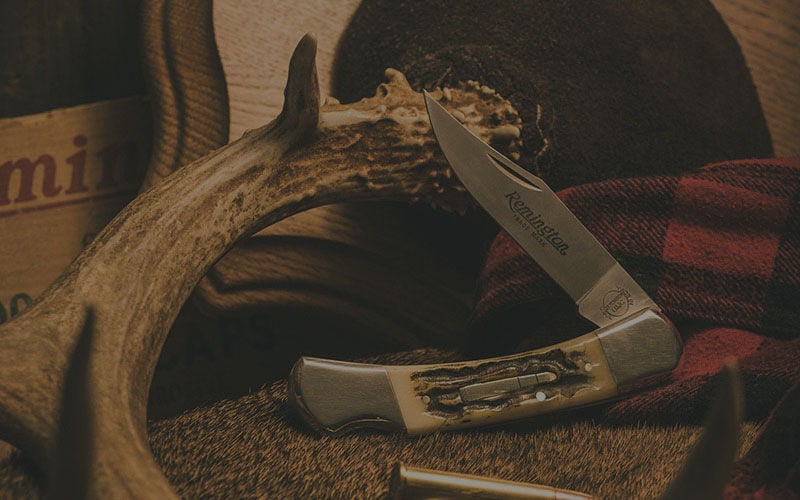 Remington Bullet knife on a table with Remington ammunition