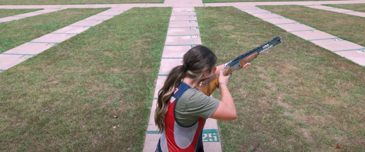 Julia Stallings aiming a shotgun