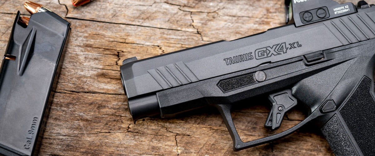 handgun and magazine laying on a table