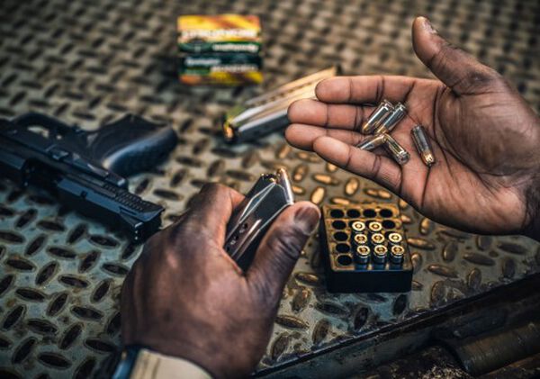 Remington cartridges being loaded into a magazine