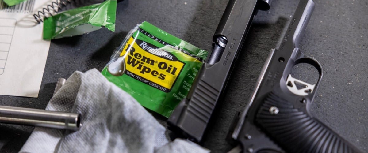 Rem Oil Wipes package next to a pistol