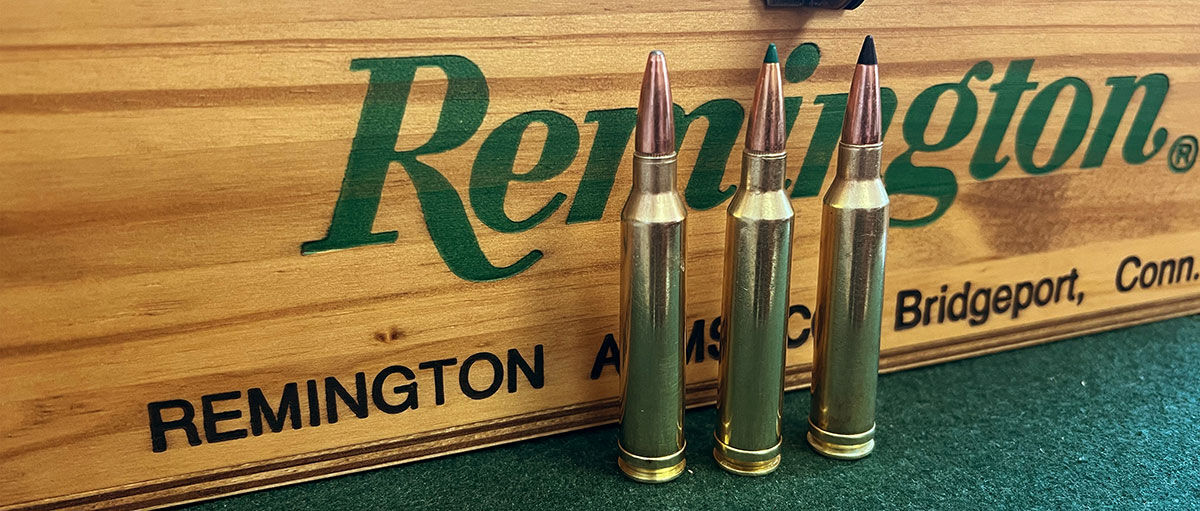 7mm Rem Mag cartridges standing in front of ammo box