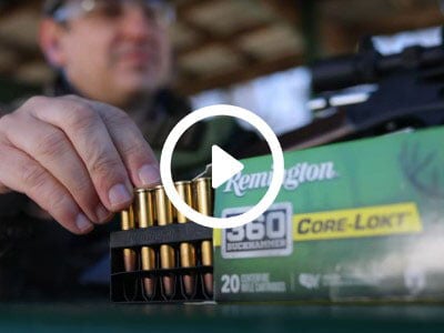 Shooter taking Core-Lokt 360 Buckhammer cartridges from packaging