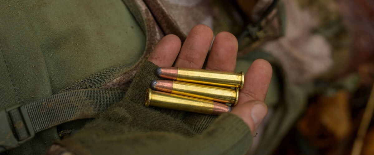 hunter holding 360 Buckhammer cartridges in their hand