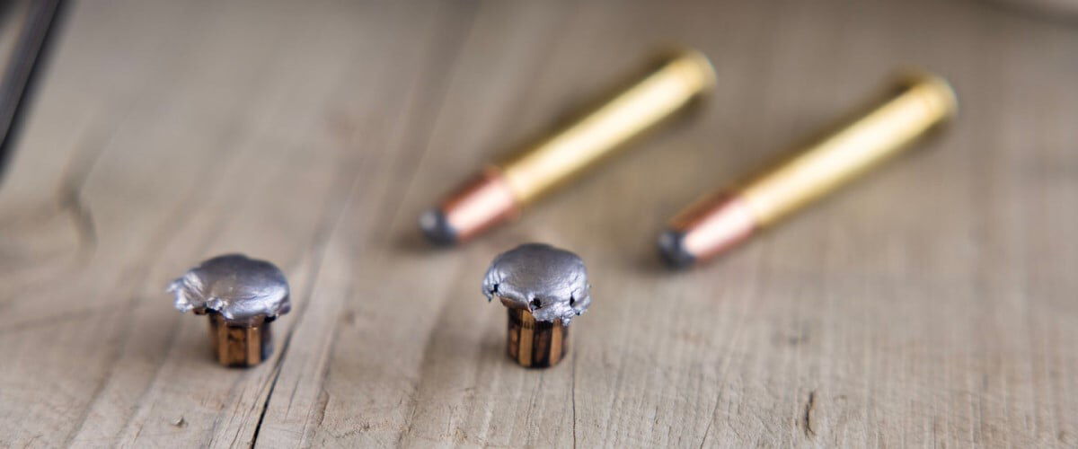 360 Buckhammer Cartridge and bullet sitting on a table