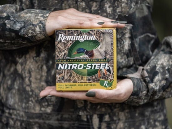 hunter holding a box of Nitro-Steel