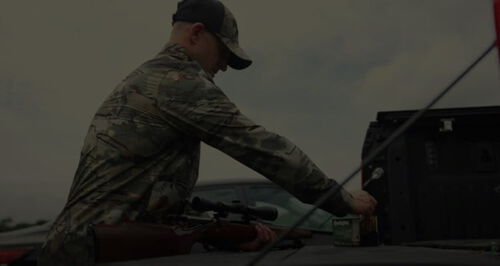 Matt Hewett loading his rifle with Remington cartridges