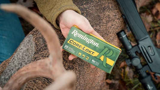 Core-Lokt box next to a deer antler and a rifle