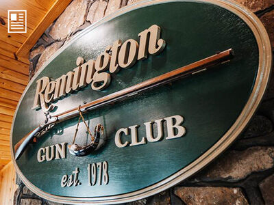 Remington Gun Club Sign handing inside the building