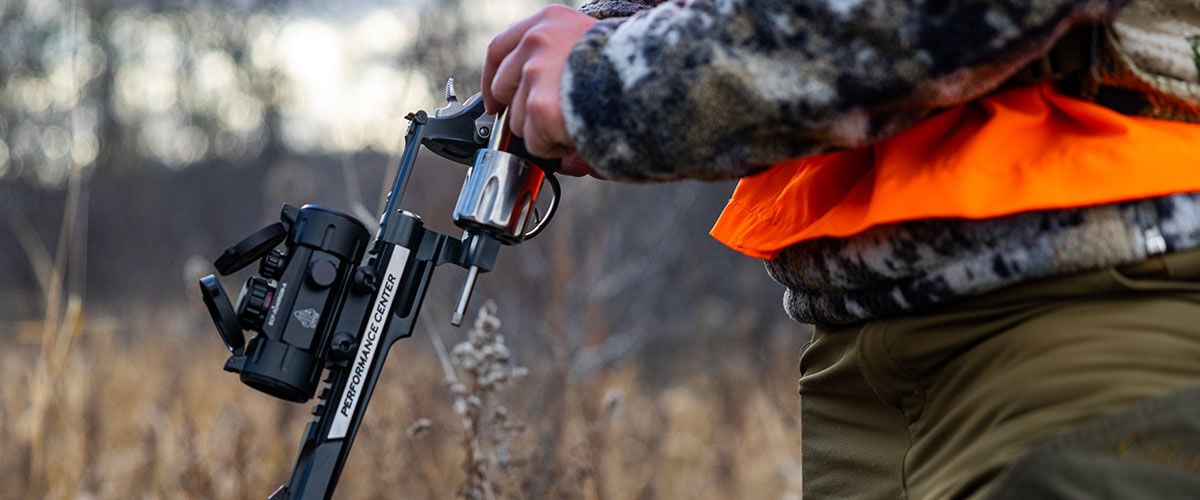 hunter loading revolver outside