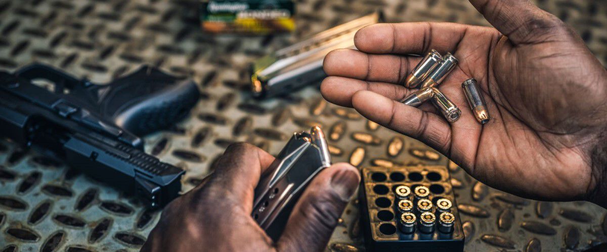 Remington cartridges being loaded into a magazine