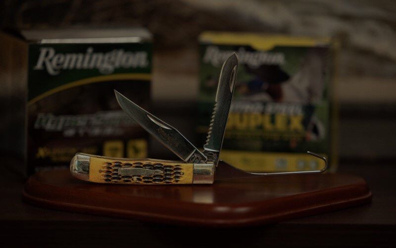 Remington Bullet knife on a table with Remington ammunition