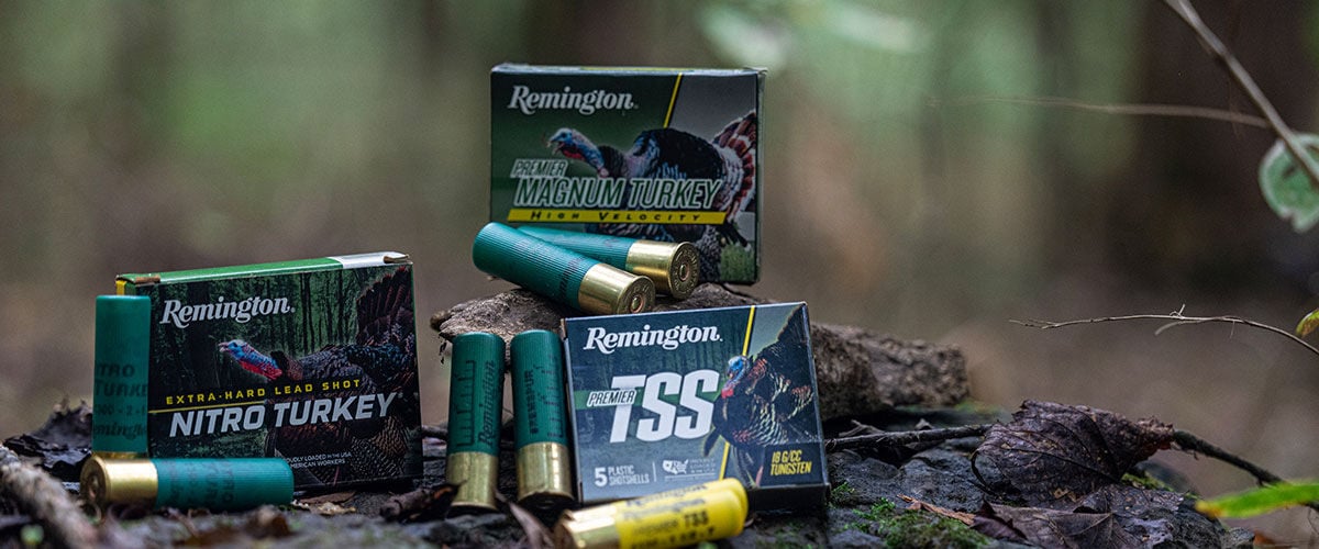 Premier Magnum Turkey, Nitro Turkey, and Premier TSS boxes on a leafy tree stump