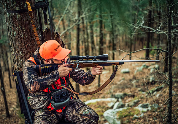 shooter shooting a rifle outside