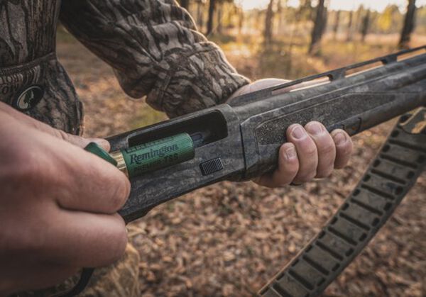 Remington Shotshell being loaded into a shotgun