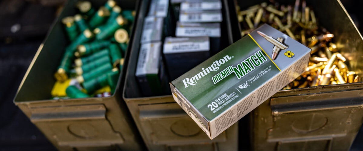 Premier Match box sitting on top of 2 ammo cans filled with ammunition