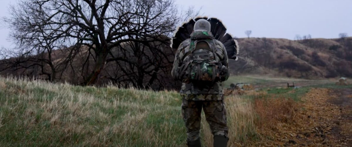 Adam Weis fanning during a turkey hunt