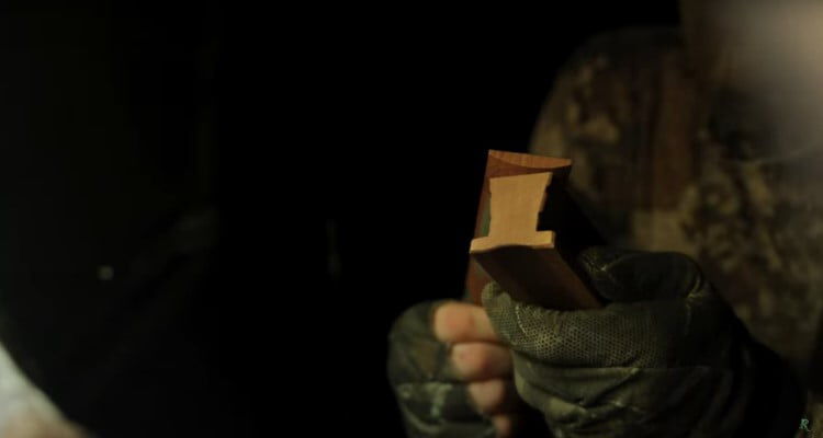 Hunter using a turkey call