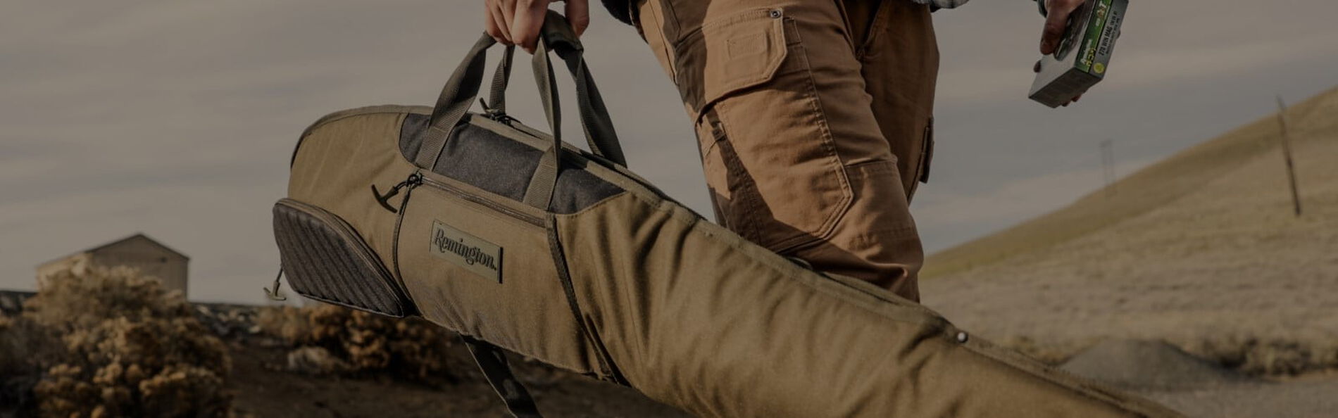 person carrying a rifle case