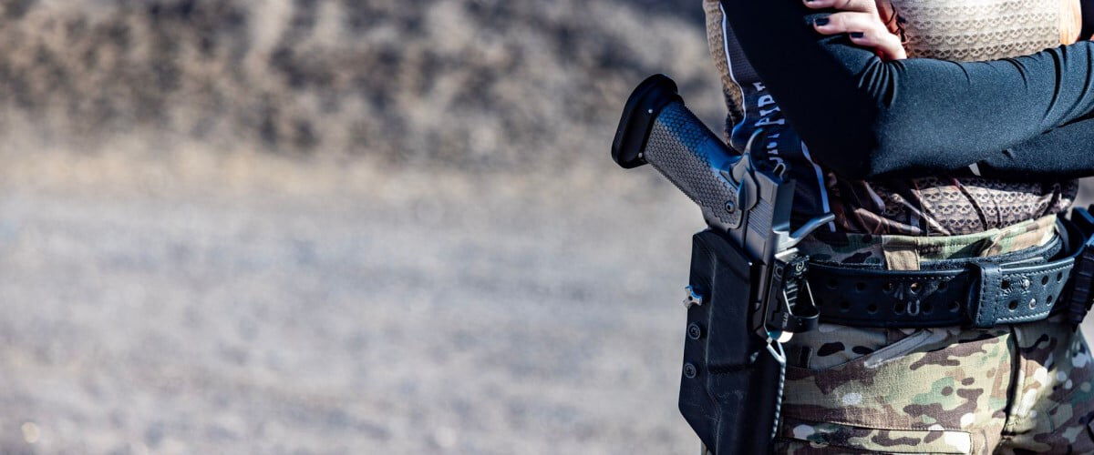 shooter with a handgun in a holster