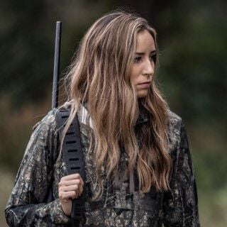 Aly from Alabama carrying a rifle on her back