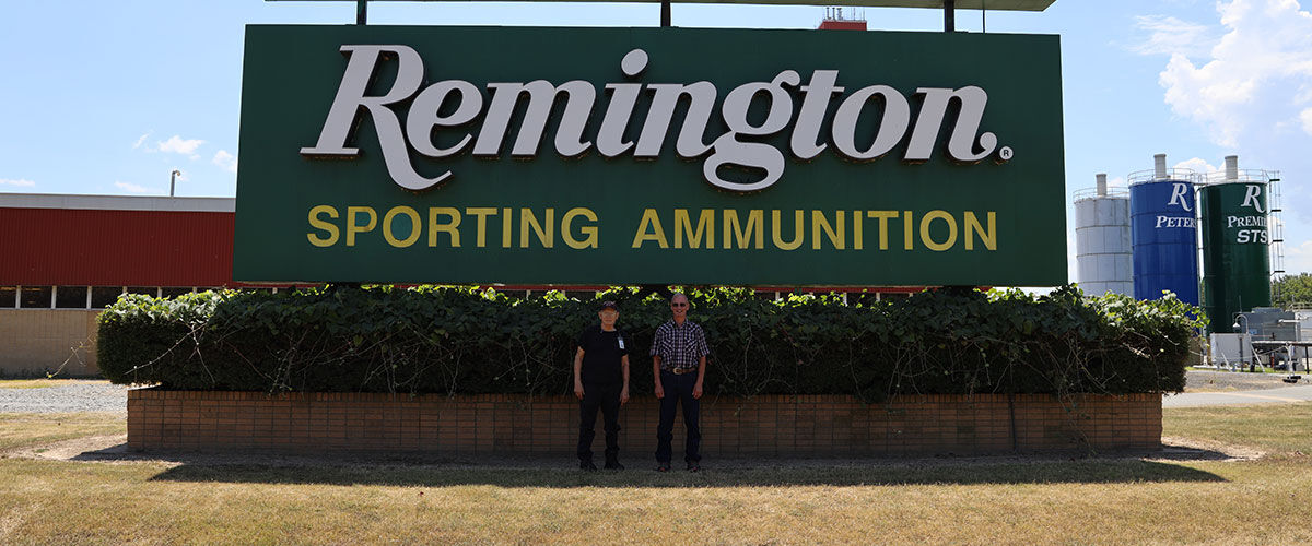 John and James in front of the Remington sign