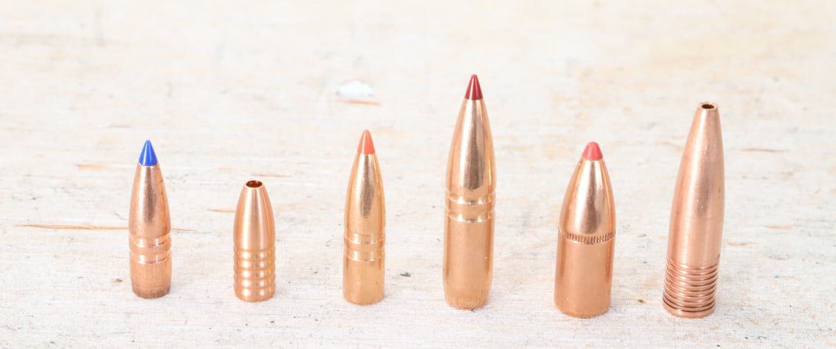 Remington copper bullets in a line on a table