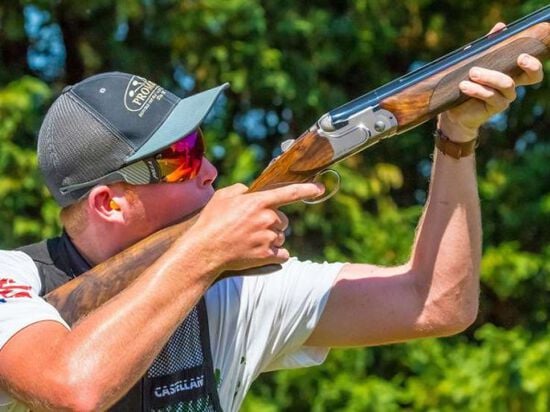 Todd Hitch aiming shotgun