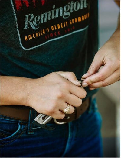 person loading a magazine