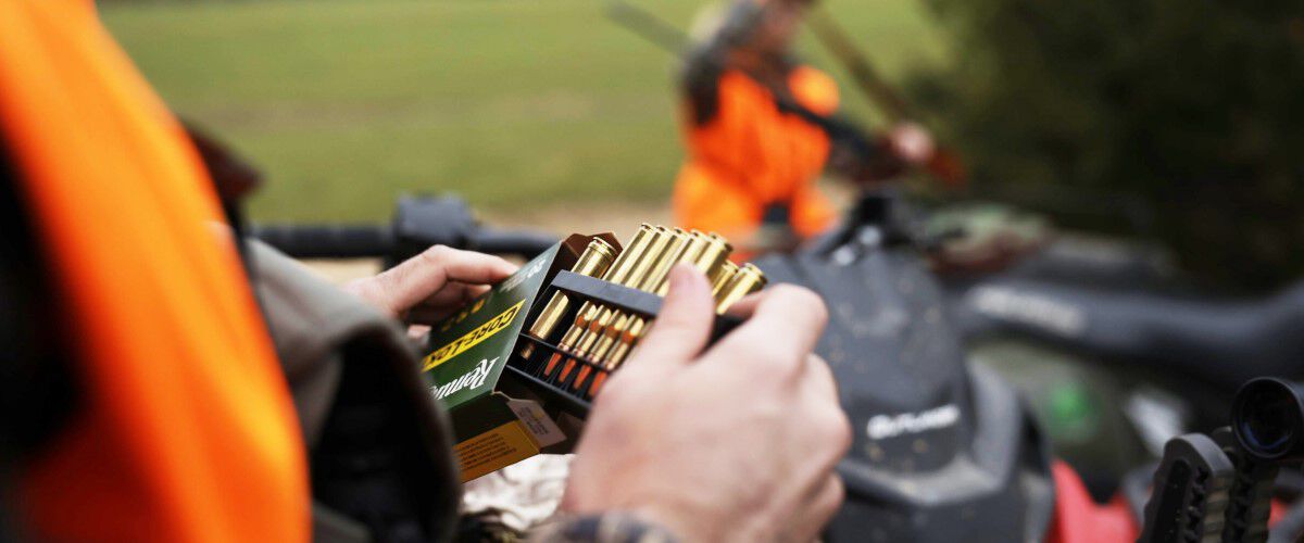 hunter removing Remington ammunition from it's packaging