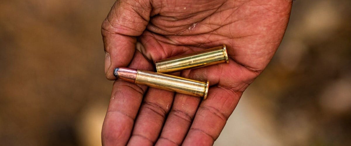 hand holding 360 Buckhammer cartridges
