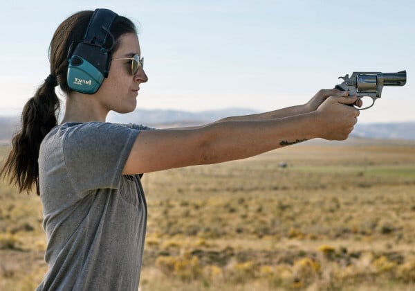 women aiming handgun