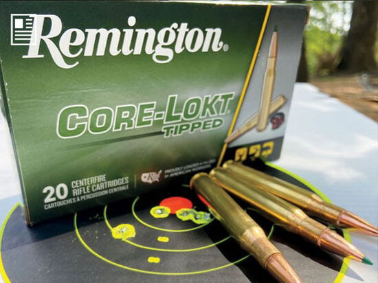 Remington Core-Lokt Tipped package with cartridges laying on top of a target