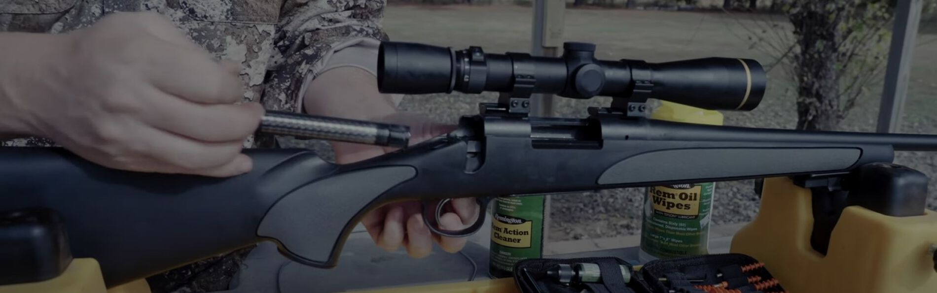 a bolt action rifle being cleaned