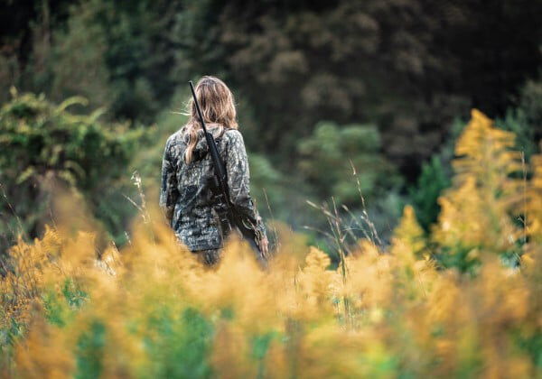 Aly from Alabama walking through a field