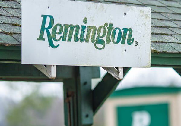 Remington logo on a sign above a shelter at the Remington Gun Club