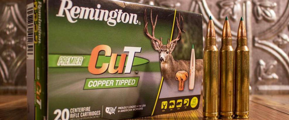Remington Premier Cut Copper Tipped packaging with 3 cartridges on a table