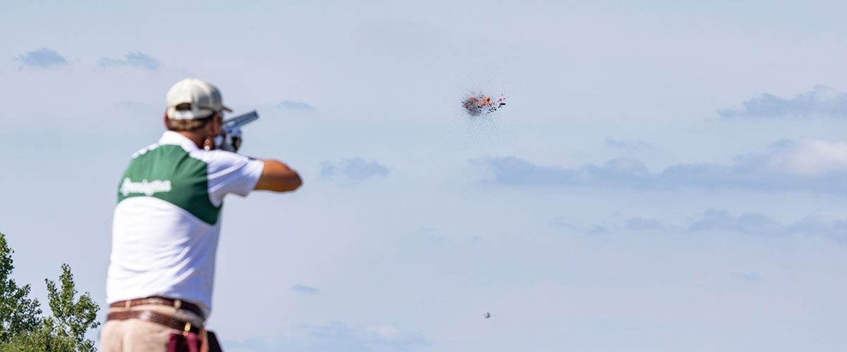 shooter shattering a clay target