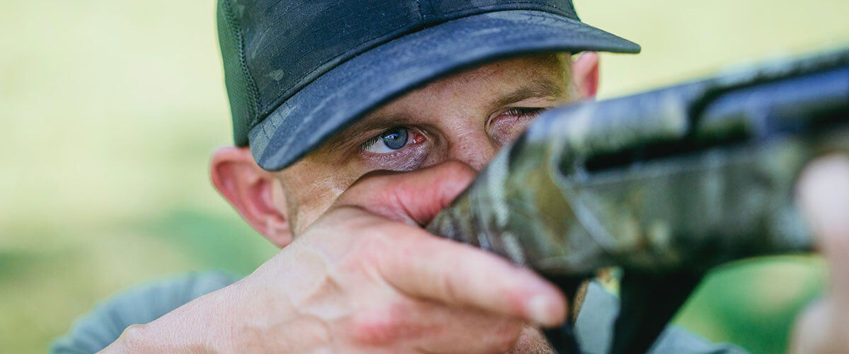 Matt Hewett looking down gun sights