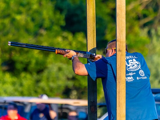 Brandon Powell aiming shotgun