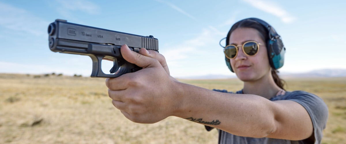 womand aiming a handgun
