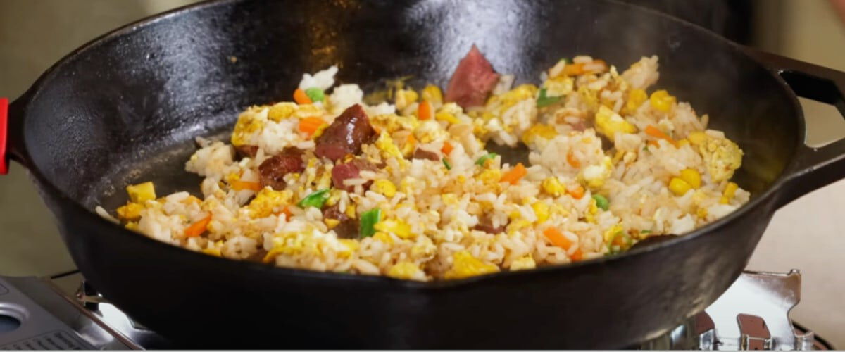 duck fried rice in a cast iron skillet