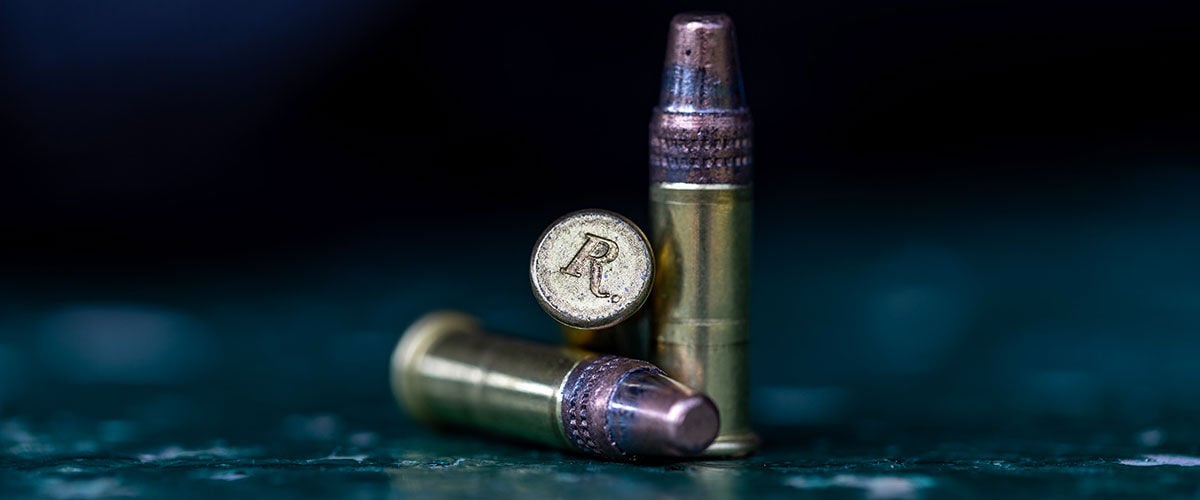 Remington rimfire cartridges sitting on a table