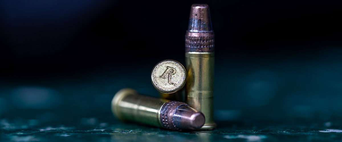 Remington rimfire cartridges sitting on a table