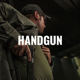 person pulling handgun from side holster