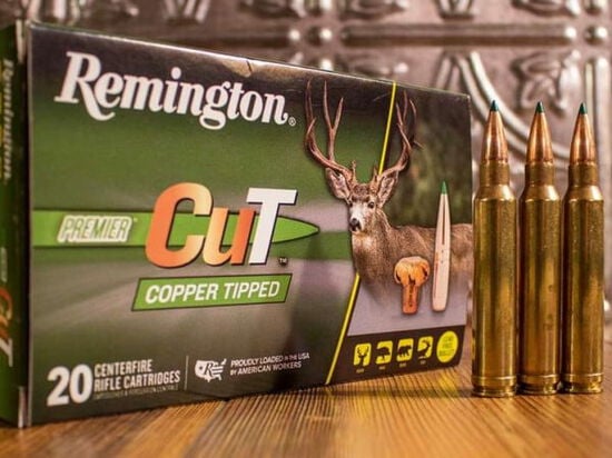 Remington Premier Cut Copper Tipped packaging with 3 cartridges on a table