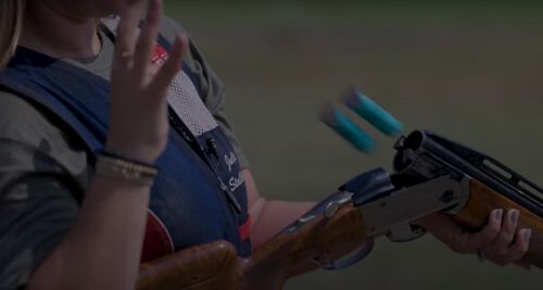 Julia Stallings catching shotshells being ejected from her shotgun